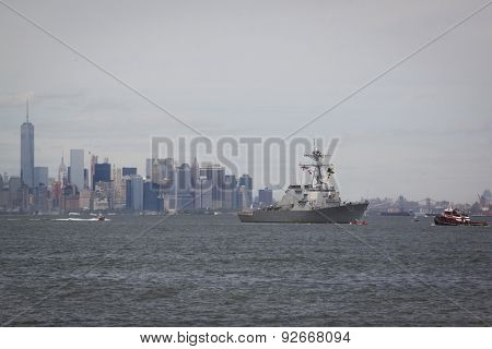 STATEN ISLAND, NY - MAY 20 2015: USS Barry (DDG 52) approaching Sullivans Pier with the buildings of Lower Manhattan in the background at the beginning of Fleet Week.