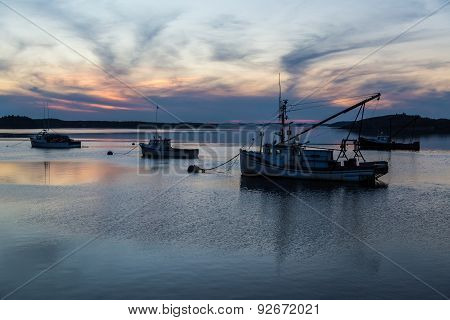 Fishing Boats At Sunset In Calm Cove