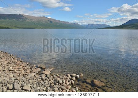 Summer landscape North of the lake. Lake in the Putorana plateau Sunny day.