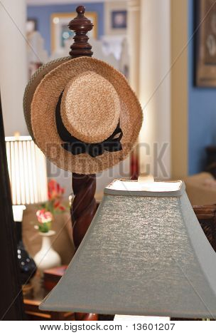 Hat On A Bedpost By Lamp