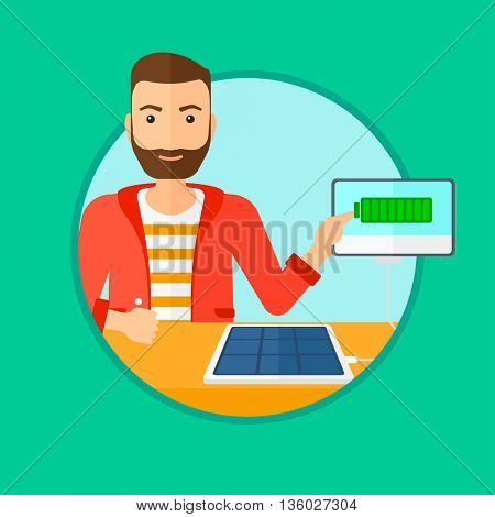 Hipster man charging tablet computer with solar panel. Charging tablet from portable solar panel. Tablet with a battery charging. Vector flat design illustration in the circle isolated on background.