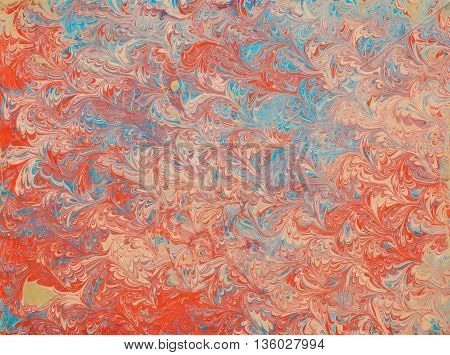 ebru imprint on beige paper. Pattern from traditional Turkish Ebru technique. painting on water followed by paper prints.