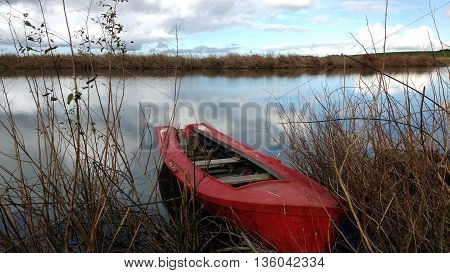 Red boat, Rocha lagoon, Uruguay. Natural reserve.