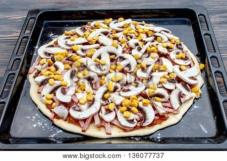 The preliminary stages of the pizza. Ingredients for cooking
