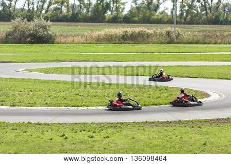 Races on karts. Men on the Karts. Car races.