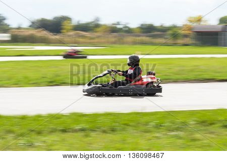 Races on karts. Man on the Kart. Car races.
