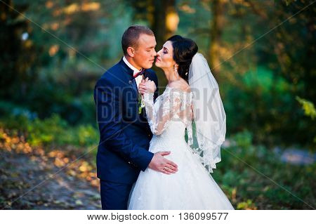 Close Up Portrait Of Young Stylish Weding Couple On Sunset