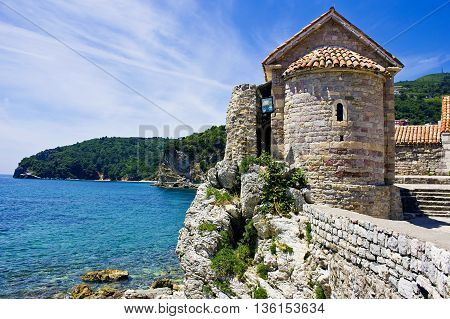 Ancient fortress standing near Adriatic sea. Budva. Montenegro. Wonderful seascape. Artistic retouching.