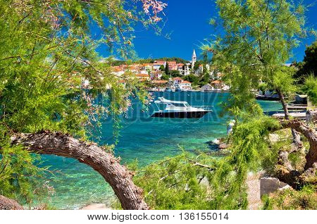Turquoise beach of Ugljan island and town of Kali view Dalmatia Croatia