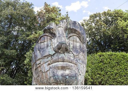 FLORENCE ITALY - MAY 18 2014 : Sculpture by Igor Mitoraj in the Boboli Gardens in Florence Italy. Works of Polish sculptor Igor Mitoraj often gigantic size stand in representative sections of many cities in the world.