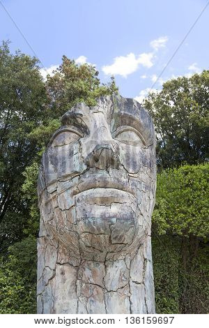 FLORENCE ITALY - MAY 18 2014 : Sculpture by Igor Mitoraj in the Boboli Gardens in Florence Italy. Works of Polish sculptor Igor Mitoraj often gigantic size stand in representative sections of many cities in the world.