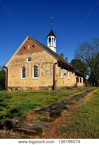 Bethabara North Carolina - April 23 2016: 1788 Gemeinhaus Moravian Church with attached minister's house at Bethabara historic settlement