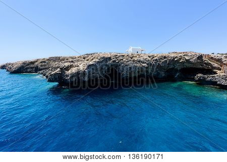 Pirate bay in protaras paralimni white church blue sea and rocks cyprus island