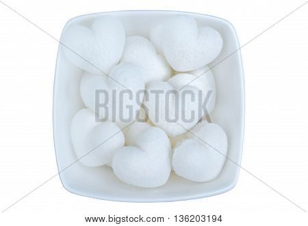 Isolated heart sugar in bowl on white background