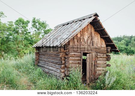 Old wooden house in mountain and river - Ukraine.