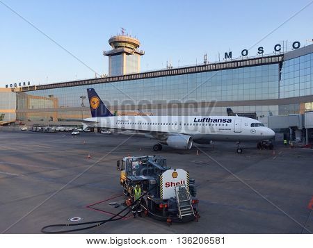 MOSCOW - JUNE 27: Aircraft and service vehicles parked airside at Moscow Domodedovo International Airport on the morning of June 27, 2016 in Moscow, Russia.