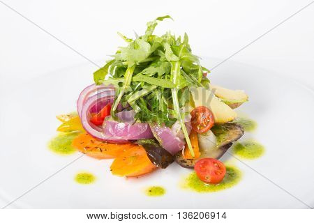Italian raw arugula salad on a whiteplate