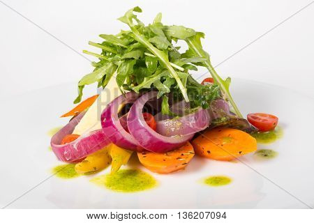 Italian raw arugula salad on a whiteplate