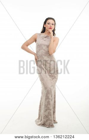 fashion model posing in studio, she wear evening dress