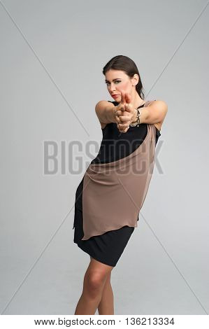 fashion model posing in studio, she wear evening dress