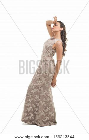 fashion model posing in studio, she wear evening dress