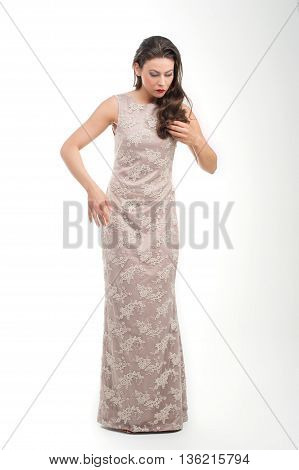 beautiful young girl posing to camera in fashion dress