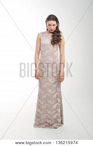 beautiful young girl posing to camera in fashion dress