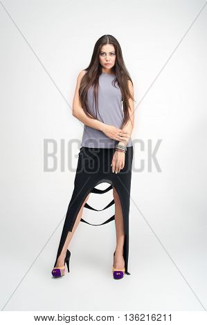 beautiful young girl posing to camera in fashion dress