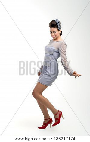 beautiful young girl posing to camera in fashion dress