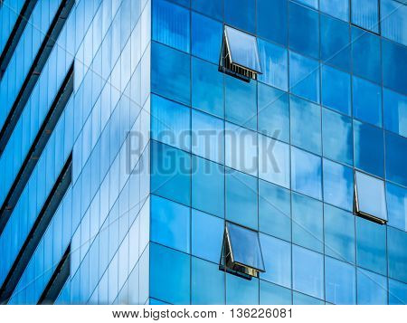 in a modern office building, a window is opened.