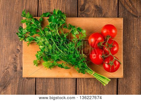 Fettuccine pasta with shrimp tomatoes and herbs. wooden background. Top view