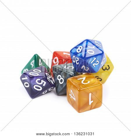 Pile of colorful roleplaying polyhedral dices isolated over the white background