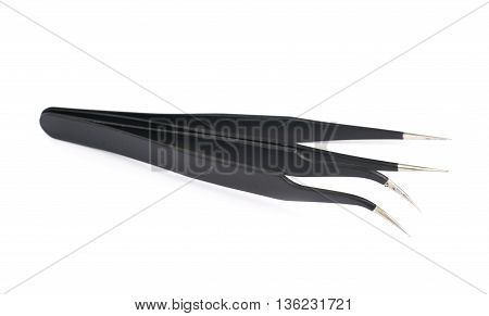 Pile of black metal anti-static tweezers tools isolated over the white background