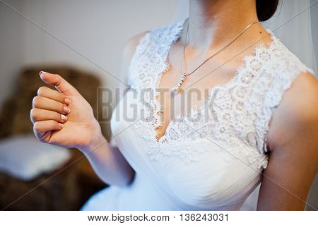 Coulomb on neck of tender bride at wedding