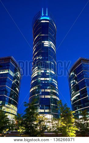 Warsaw, Poland - May 25, 2016: The Warsaw Spire is a complex of Neomodern office buildings in Warsaw, Poland constructed by the Belgian real estate developer Ghelamco. It consists of a 220-metre main tower with a hyperboloid glass facade, and two 55-metre