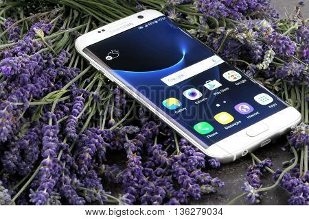 Koszalin, Poland  June 29, 2016: Photo of Samsung Galaxy S7 Edge white pearl. Samsung 7 Edge are new generation smartphone from Samsung. The Samsung S7 Edge is smart phone with multi touch screen