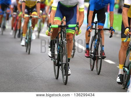 Very Fast Cyclists Pedal Quickly Through The Streets Of The City