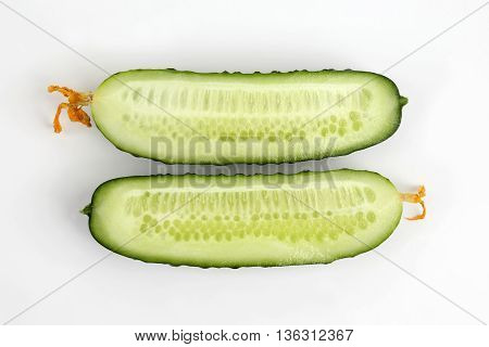 cut lengthwise the cucumber on the white background