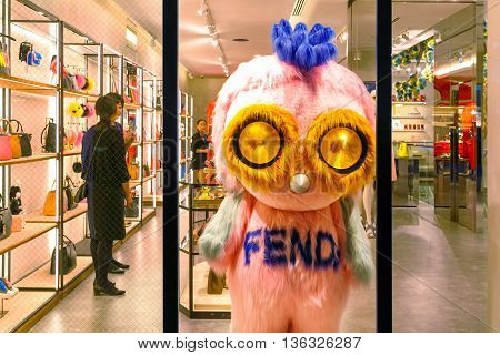 TOKYO JAPAN - NOVEMBER 28 2015: Unidentified people dresses up a cartoon mascot in front of Fendi boutique at Ginza district