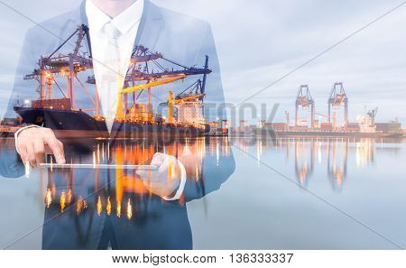 Double Exposure Of Businessman Hand Hold Tablet