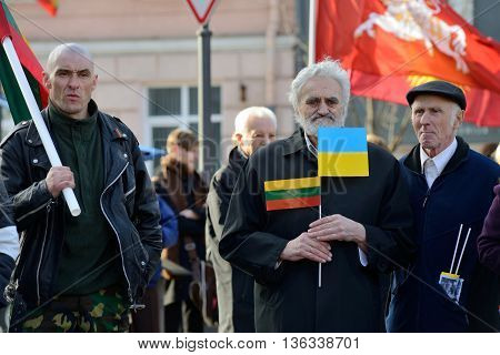 VILNIUS, LITHUANIA - MAR 11: Around one thousand people gathered with flags in a nationalist rally at Rotuses Square on Re-Establishment of Independence Day on March 11, 2014 in Vilnius, Lithuania