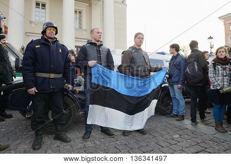 VILNIUS, LITHUANIA - MAR 11: Around one thousand people gathered with flags in a nationalist rally at Rotuses Square on Re-Establishment of Independence Day on March 11, 2014 in Vilnius, Lithuania