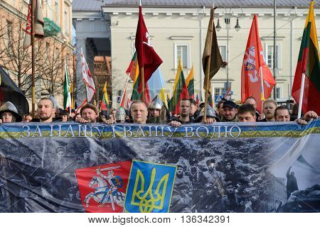 VILNIUS, LITHUANIA - MAR 11: Around one thousand people gathered with flags in a nationalist rally at Rotuses Square on Re-Establishment of Independence Day on March 11, 2014 in Vilnius, Lithuania