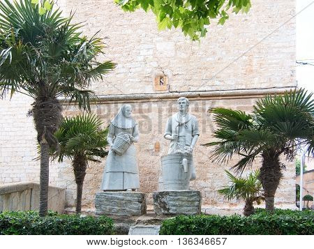 Man And Woman Winery Workers Stone Sculpture