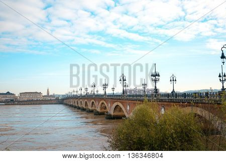 Old stony bridge in Bordeaux, France Europe