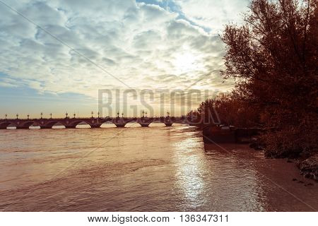 Old stony bridge in Bordeaux, France Europe