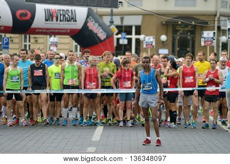 VILNIUS LITHUANIA - SEPTEMBER 14: Runners on start of 11th Danske Bank Vilnius Marathon on 14 September 2014 in Vilnius Lithuania. Vilnius Marathon became a member of AIMS in 2007.