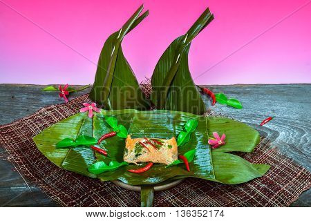 curried fish wrapped in banana leaves and steamed