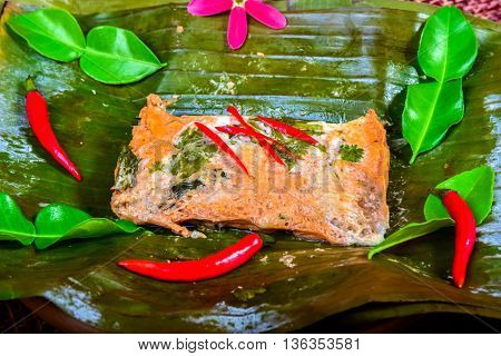 curried fish wrapped in banana leaves and steamed