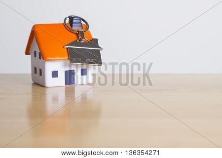 Silver key ring showing property value on the decreasing